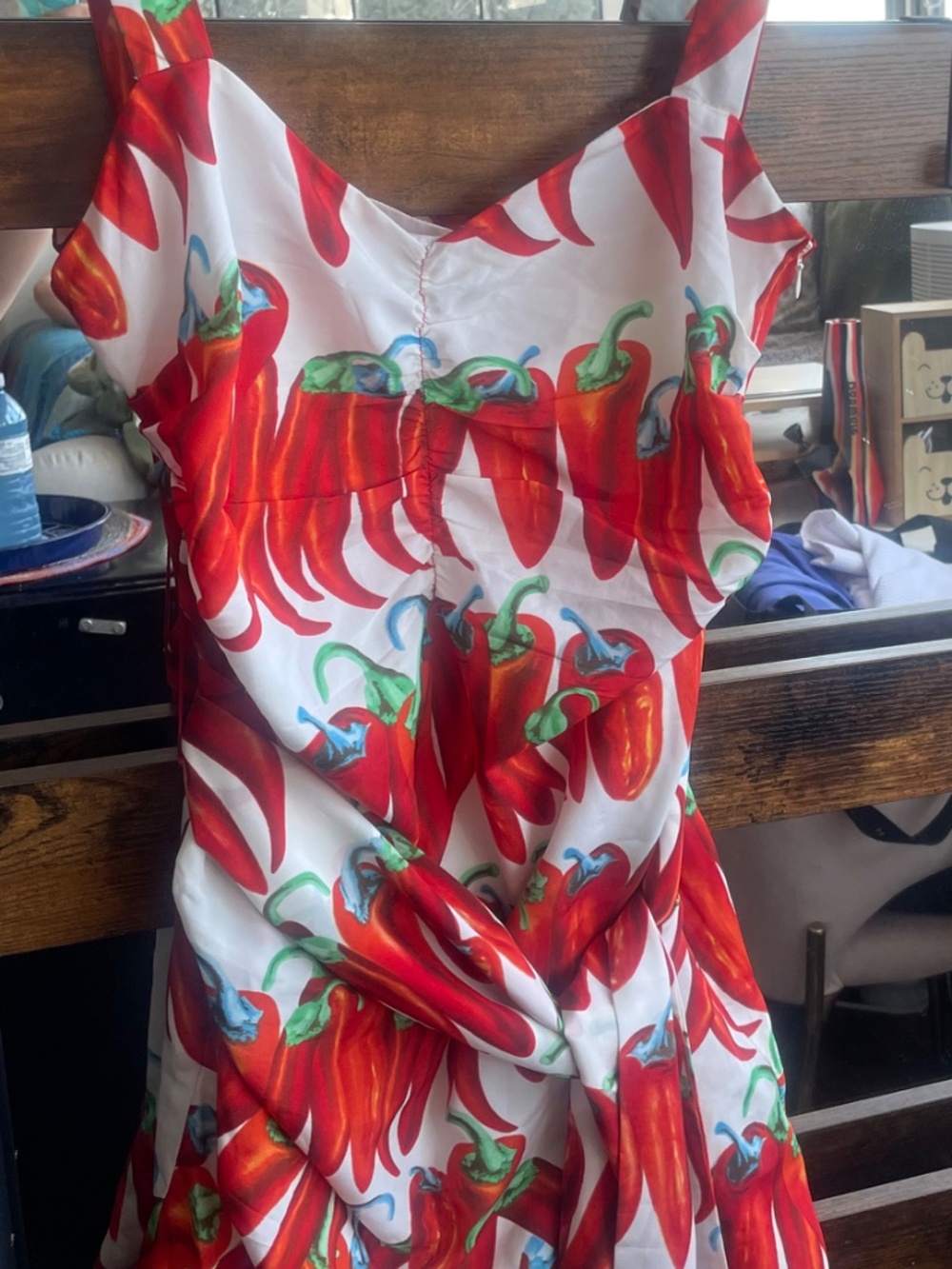 Red chili pepper print ruched mini dress featuring a side bow accent - Picture 5 of 10